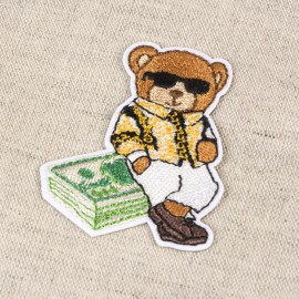 M MOTIF TEDDY BEAR WITH DOLLARS